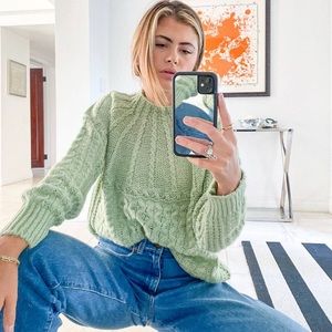 Oversized pastel green cable knit sweater